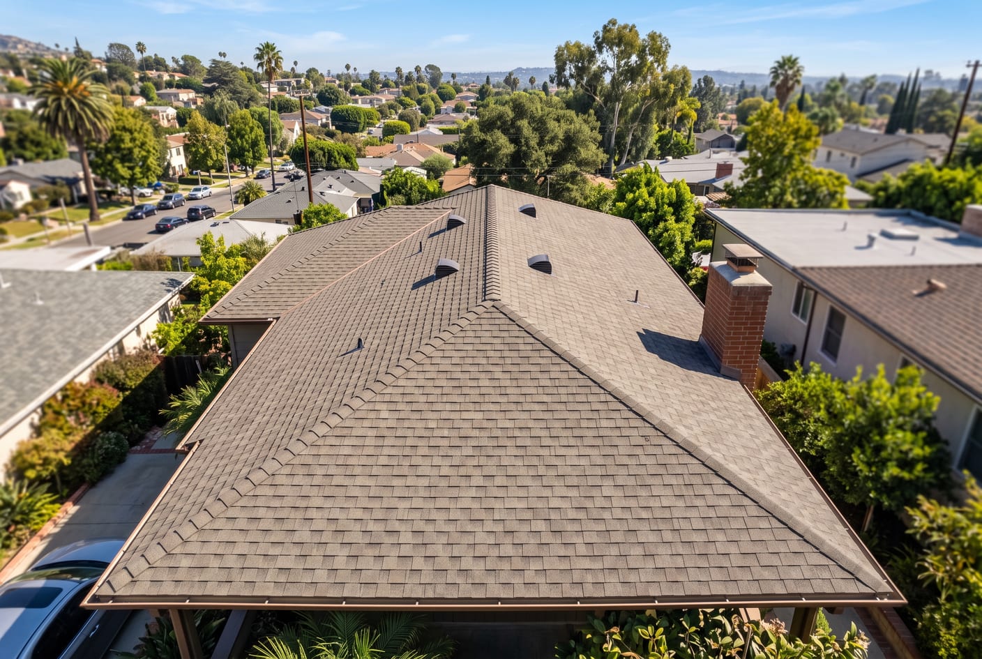 A steep aerial view of a Los Angeles home's composition shingle roof